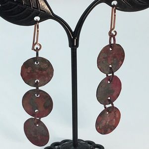 Hand crafted Copper flame patina dangles with sealed antique copper ear wires.